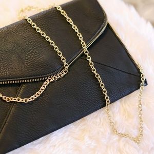 Black clutch/crossbody strap